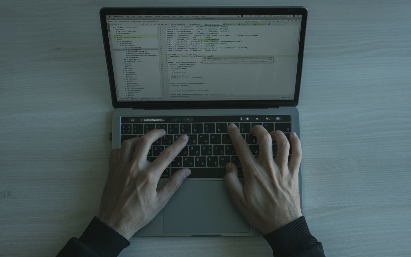An engineer building an app, the working code on screen